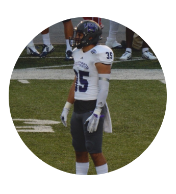 A Guy Wearing a Football Helmet